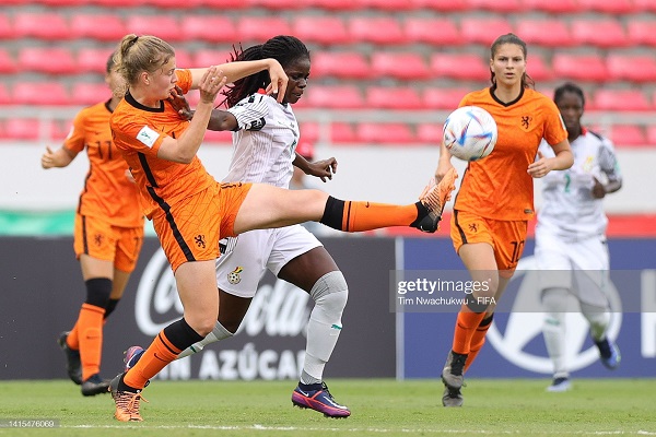 Senna Koeleman of the Netherlands and Mukarama Abdulai of Ghana challenge for the ball in Tesday's group match